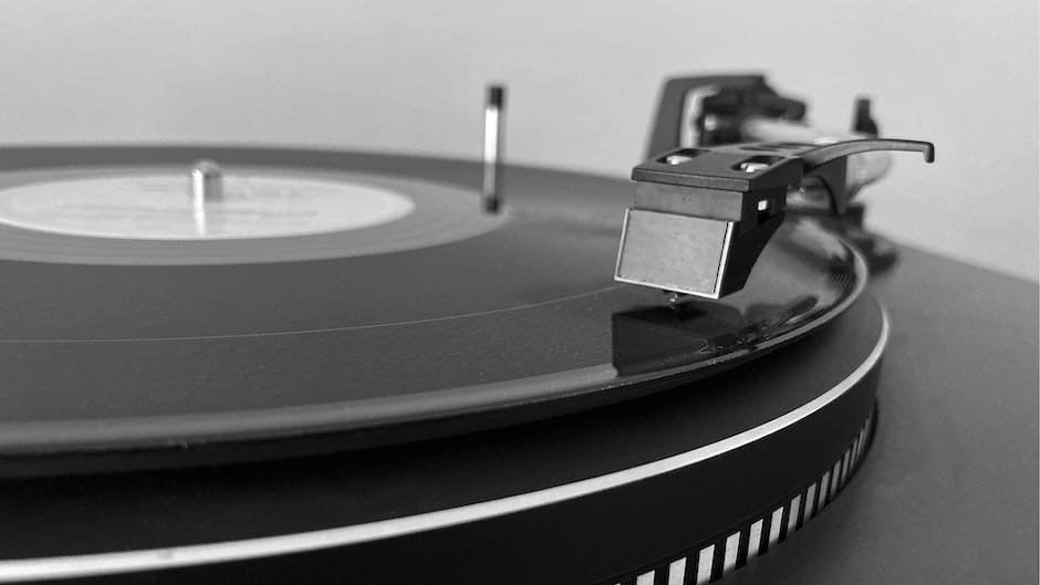 A Classic Vinyl Record Playing on a Black Turntable
